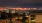 view of neighborhood and Bellevue, WA skyline lit up at night