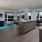 open concept apartment interior brightened by many large windows and recessed lights