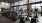 cardio machines face wall of floor-to-ceiling windows in fitness center